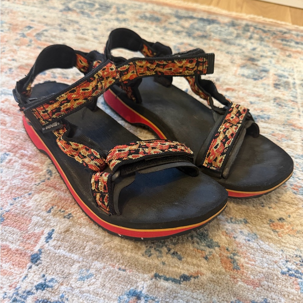 Teva Women's Black Sandals with Red and Orange Patterned Straps